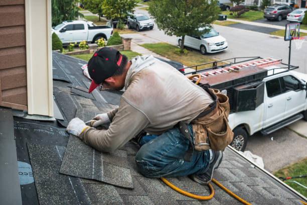 Professional Roofing technician working in East Smithfield, PA